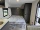 2027 Forest River Acclaim 16RB bed with overhead shelf and wardrobe